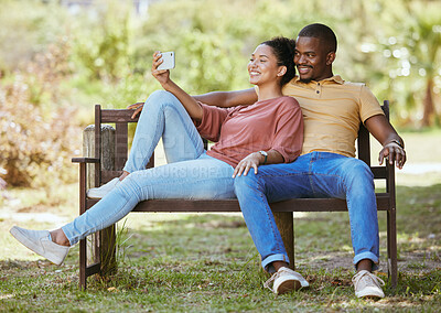 Buy stock photo Phone, relax or couple taking a selfie in a park for a lovely date in a natural environment for fresh air. Nature, profile picture or happy black woman taking social media pictures with a black man