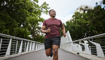 Fitness, exercise and black man running in city for health and wellness. Sports, runner or young male from Nigeria jog, exercising and cardio workout outdoors on bridge training for marathon practice