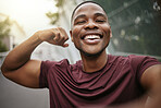 Selfie, smile and fitness arm flex of a black man athlete ready for running, workout and exercise. Training, happy and runner man portrait with motivation for sport, wellness and muscle health 