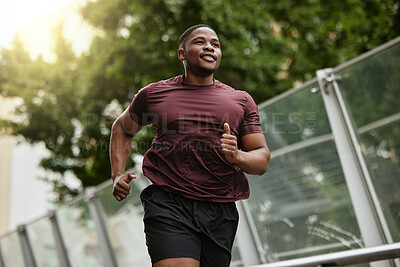 Buy stock photo Black man, fitness and running in park for healthy workout, exercise or cardio in the nature outdoors. Happy African American male runner enjoying a jog, run or exercising for health and wellness