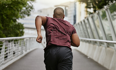 Buy stock photo Back, black man and running outdoor, workout and training for marathon, wellness and health. African American male, athlete and runner practice on street, fitness and exercise for energy and cardio.