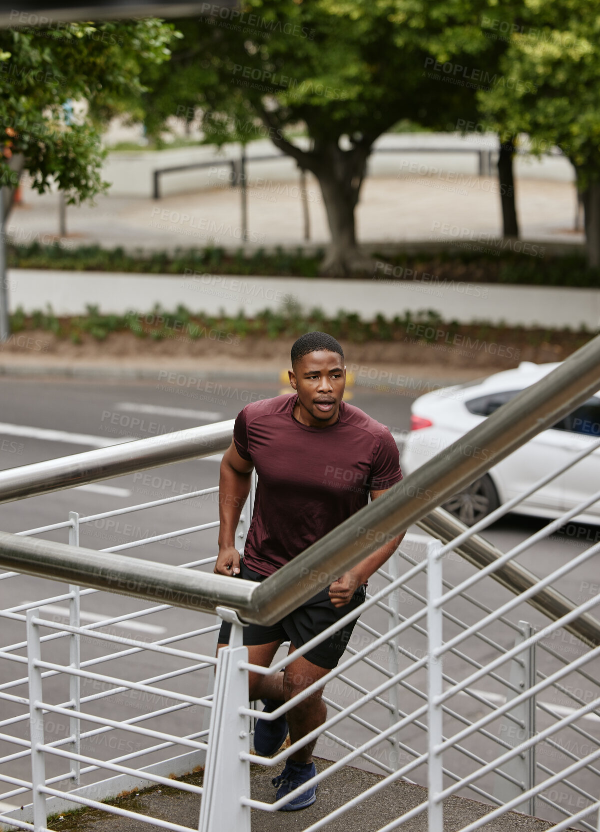 Buy stock photo Black man, fitness and running on city stairs in cardiovascular workout, healthcare exercise or morning wellness training. Runner, sports athlete and personal trainer on steps for body muscle growth