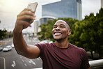 Selfie, black man and in city with smile, on vacation and cheerful for break, casual and relax. African American male, guy and smartphone for social media, connection and in town for chill or weekend