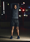 Black man, outdoor and stretching at night, fitness and exercise for health, body care and balance. African American male, evening or dark in city, workout and training for healthcare, power or relax