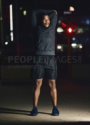 Buy stock photo Black man, outdoor and stretching at night, fitness and exercise for health, body care and balance. African American male, evening or dark in city, workout and training for healthcare, power or relax