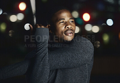 Buy stock photo Black man, fitness and stretching at night in the city for workout, exercise or preparation in the outdoors. African American male in evening warm up arm stretch getting ready for cardio exercising