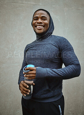 Buy stock photo Black man runner, happy and portrait by wall, city and water bottle for health, fitness or wellness. Urban man, smile and happiness for running, training or workout in metro with self care in Chicago