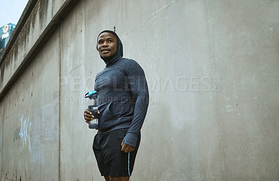 Buy stock photo Fitness, water bottle and black man in city after training, exercise and running. Sports, break and male runner with refreshing liquid after jog, exercising or workout in town or street in winter.
