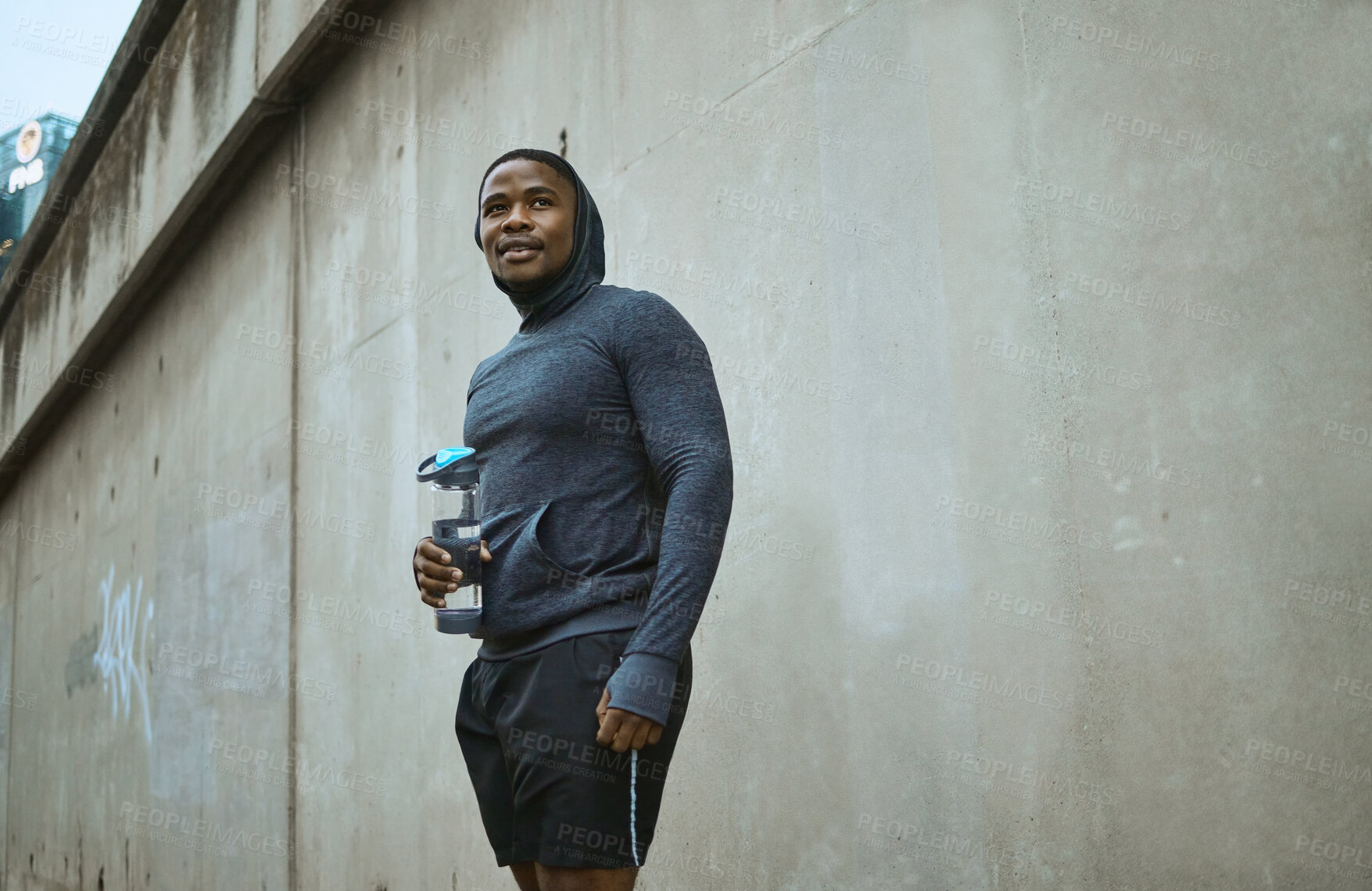 Buy stock photo Fitness, water bottle and black man in city after training, exercise and running. Sports, break and male runner with refreshing liquid after jog, exercising or workout in town or street in winter.