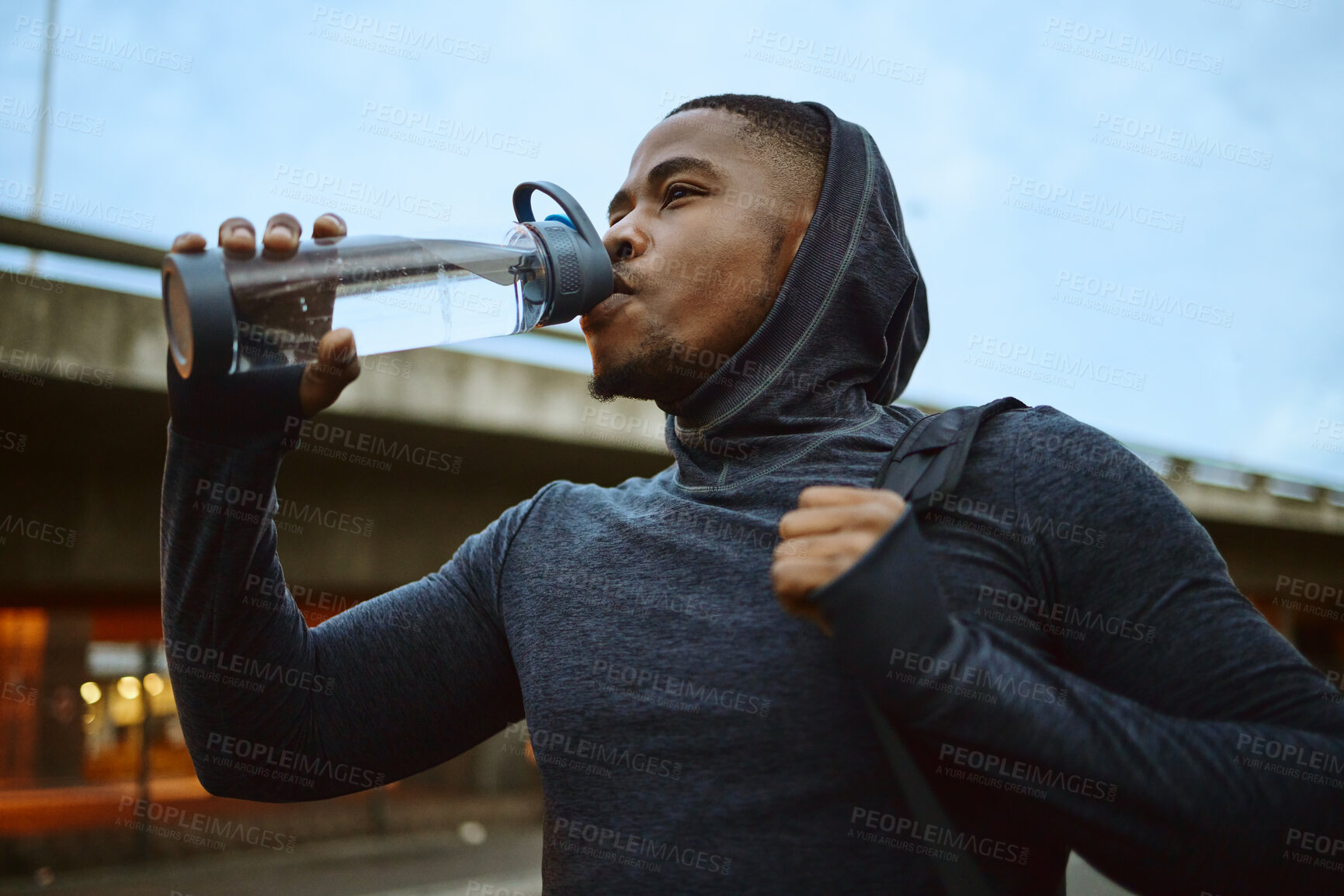 Buy stock photo Black man, drinking water or city fitness break for sunrise workout, healthcare training or wellness morning exercise. Runner, sports athlete or drink bottle for personal trainer with running goals