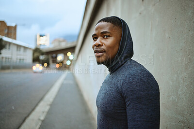 Buy stock photo Fitness, workout and black man in the city training for a marathon, race or sport competition. Sports, runner and male African athlete doing a cardio exercise for endurance, speed and health in town.