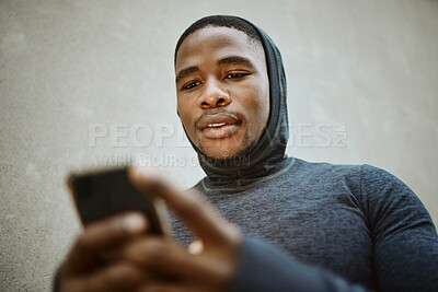 Buy stock photo Fitness, black man and phone typing in city to check social media, internet or search mobile app, online sports blog and exercise tech. Young athlete reading notification on smartphone before workout