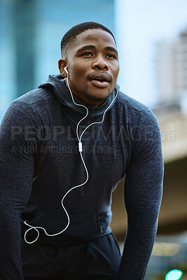 Buy stock photo Breathe, black man and fitness break for city workout, wellness exercise and running outdoors. Runner, breathing and relax after cardio marathon with music earphones for motivation, mindset and goals