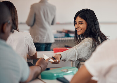 Buy stock photo University, note and students cheating in exam passing paper notes in classroom. College corruption, education fraud and teamwork of woman helping man with answers in math examination test at school.