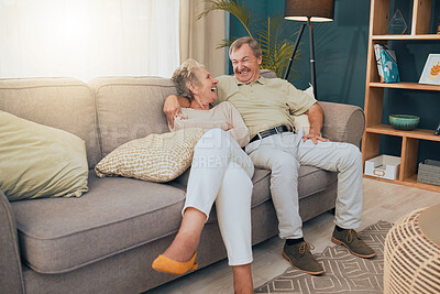 Buy stock photo Senior couple, bonding or laughing on sofa, house or home living room in trust, love or Canada security. Smile, happy or comic retirement elderly, man or woman on relax furniture in funny comedy joke