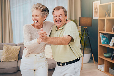 Buy stock photo Happy, dance and senior couple in a living room, smile and fun while being silly in their home together. Happy family, love and man with woman dancing, laughing and goofy while enjoying retirement