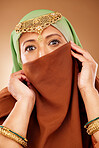 Muslim woman, face or fashion burka on studio background for Iranian human rights, religion pride or traditional empowerment. Zoom, portrait or islamic beauty model with hijab, scarf or gold jewelry
