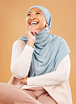Muslim, woman and smile for happy thoughts on a studio background while thinking about peace, Islam and faith in religion. Beauty arab culture with female in hijab for Islamic fashion and pride