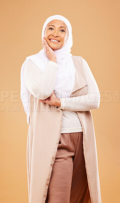 Buy stock photo Fashion, beauty and portrait of muslim woman in studio isolated on an orange background. Skincare, cosmetics and mature Islamic female from Dubai in makeup posing in stylish hijab and modern clothes.