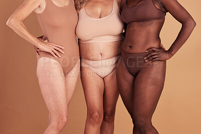 Buy stock photo Diversity, closeup or women with body positivity, wellness or support on brown studio background. Multiracial, females or ladies with solidarity, skincare or confident for natural beauty or community