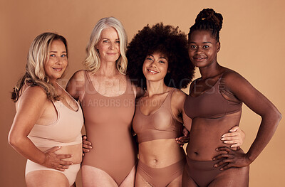 Buy stock photo Beauty, diversity and women in lingerie hug in studio isolated on a brown background. Portrait, underwear or body positive group of friends in makeup or cosmetics embrace for self love or empowerment