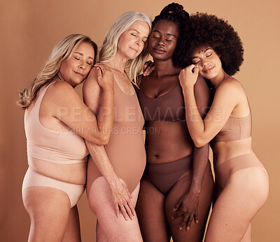 Buy stock photo Plus size women, model group and lingerie in studio for support, solidarity and diversity with comfort. Body positive, multicultural woman and underwear with hug, love and together by studio backdrop
