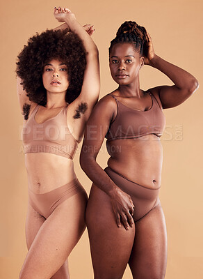 Buy stock photo Body positive, empowerment and black women with body hair for natural beauty, care for skin and confidence on brown studio background. Self love, wellness and African model friends with hairy armpit