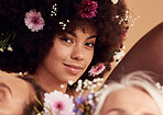 Black woman, flowers and smile for beauty portrait in studio for skincare wellness, luxury makeup aesthetic and cosmetics hair care. Spring floral art, happiness and facial care or dermatology glow