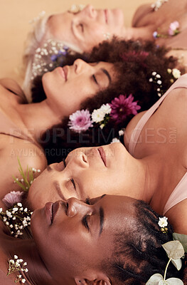 Buy stock photo Sleeping, relax and face of women with flowers for peace, skincare and natural makeup against a studio background. Floral, sleep and diversity with model people, flower crown and calm beauty
