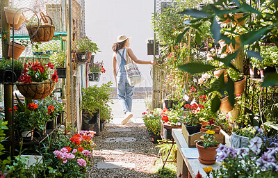 Buy stock photo Woman, walking or shopping in small business florist or green leaf plants, flowers or sustainability growth. Garden center, nursery or greenhouse customer in spring store or Canada retail marketplace
