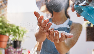 Buy stock photo Covid, hands and sanitizer with a woman cleaning using a disinfectant spray in a small business greenhouse. Compliance, spraying or bacteria with a female florist working during corona virus pandemic