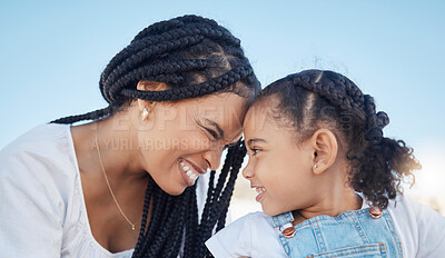 Buy stock photo Family, outdoor and love of a mother and daughter together for fun at a park while touching heads with a smile, happiness and care during travel. Black woman and child against blue sky for freedom