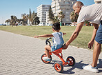 Child, girl or father pushing bike on city promenade for riding learning, cycling education or Brazilian freedom fun. Smile, happy or bonding man with kid on bicycle sports, wellness trust or games