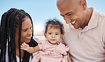 Mother, father and baby in nature as a happy family on summer holiday vacation in Rio de Janeiro, Brazil. Relaxed father, mom and cute newborn girl love enjoying fun quality time or bonding at beach