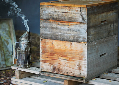 Buy stock photo Wooden box, smoke or beekeeper equipment on sustainability agriculture, countryside environment nature honey farm. Smoking tool, honeycomb container or bees production management for food collection