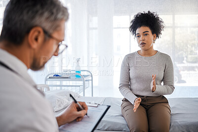 Buy stock photo Healthcare, consulting and insurance with a black woman patient sitting in a hospital with her doctor. Medical, consultant and insurance with a female talking to a medicine professional for diagnosis