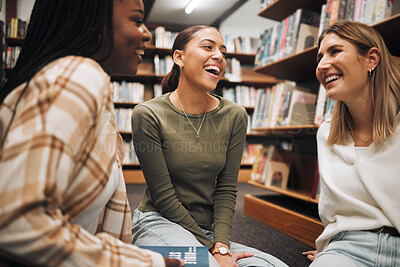 Buy stock photo College friends, library and together to study while talking about book, research and knowledge from education and learning. University women happy during funny conversation while studying at school
