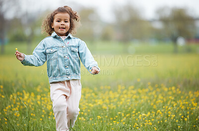 Buy stock photo Girl child, field and flower on walk in nature park, garden or backyard for happiness, playing and relax. Young female kid, walking with wild flowers, natural plants or outdoor by trees, grass or sun