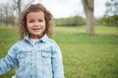 Buy stock photo Child, face and park with grass field while outdoor for fun, travel and freedom in spring on vacation with smile, happiness and positive energy. Face of cute girl in nature with green background