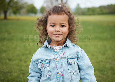 Buy stock photo Child, face and park with a smile outdoor on a grass field for freedom, play and summer vacation while happy and excited. Portrait of girl kid toddler in nature for fun spring travel adventure in UK