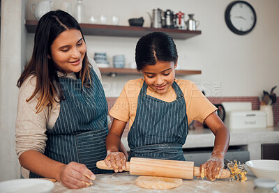 Buy stock photo Family, mother and girl baker with a pin rolling dough helping baking a cake, food or cookies in a house kitchen. Child development, learning or happy mom teaching a young Indian kid cooking skills 
