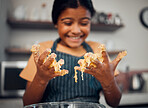 Girl, hands and dough while learning cooking in home kitchen. Baking, education and happy child chef with bowl and flour mixture, smiling and having fun while preparing delicious pastry in house.