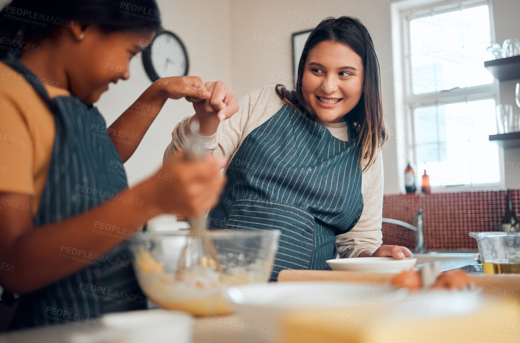 Buy stock photo Mom, girl and cooking with learning, motivation and teaching for cookies, bonding and care in home kitchen. Baking, mother and daughter with celebration, teamwork and fist bump with love in Toronto