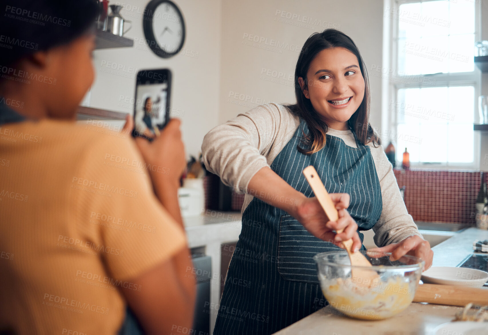 Buy stock photo Baking, tutorial and social media with a chef woman in the kitchen of her home cooking as an influencer. Food, phone and vlog with a female cook preparing baked goods while live streaming in a house