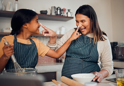 Buy stock photo Mother, girl and cooking while playing with flour, having fun or bonding. Learning, education and happy child chef with caring mom baking pastry, smiling and enjoying time together with dough on nose