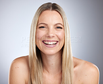 Buy stock photo Beauty, skincare and face of happy aesthetic woman with a smile for hair care, cosmetics and makeup on a gray studio background with a glow. Portrait of a female showing dermatology results on skin