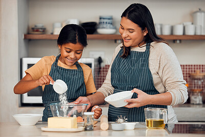 Buy stock photo Mother, girl and learning cooking in kitchen, bonding or having fun. Love, care and happy mama teaching kid chef baking, mixing flour in bowl and smiling while enjoying quality time together in house