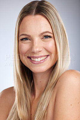 Buy stock photo Portrait, beauty and skincare with a model woman in studio on a gray background for natural treatment. Face, happy and smile with an attractive young female posing to promote a cosmetic product
