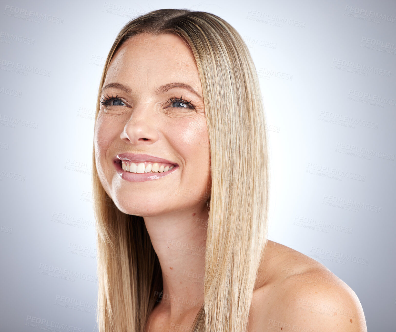 Buy stock photo Beauty, woman and hair in studio with blonde color, shine and glow from rich keratin texture, wellness and skincare on gray background. Happy model, natural cosmetics and healthy hair care shampoo 