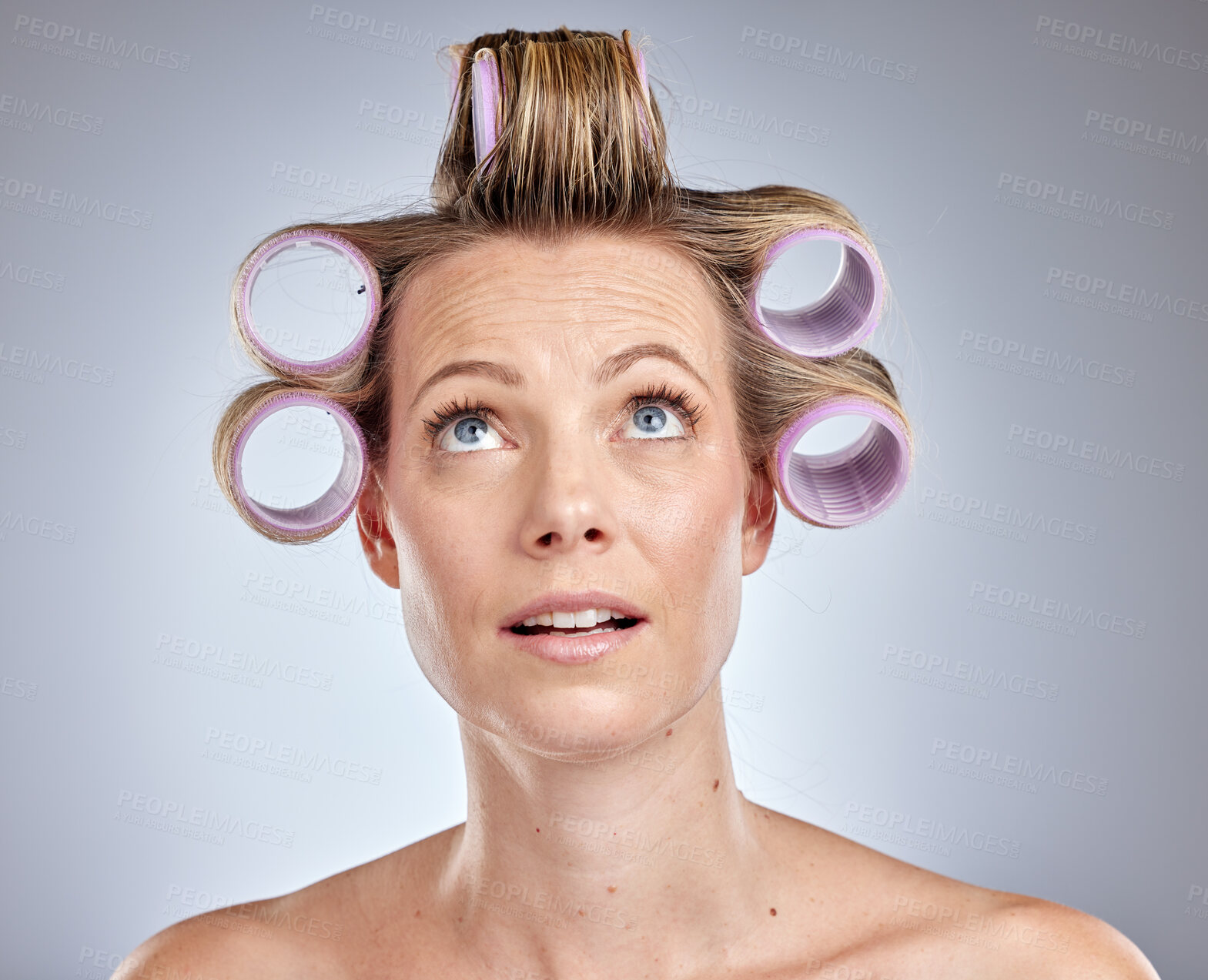 Buy stock photo Hair, beauty and woman with roller in studio on gray background for wellness, hairstyle and hair care. Fashion, beauty salon and comic face of girl with hair curler, cosmetics and hair treatment